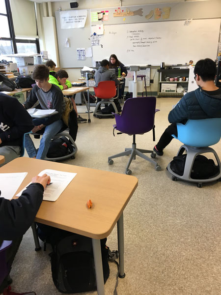 Students in Mrs. Bullingers class try out the new desks and chairs.