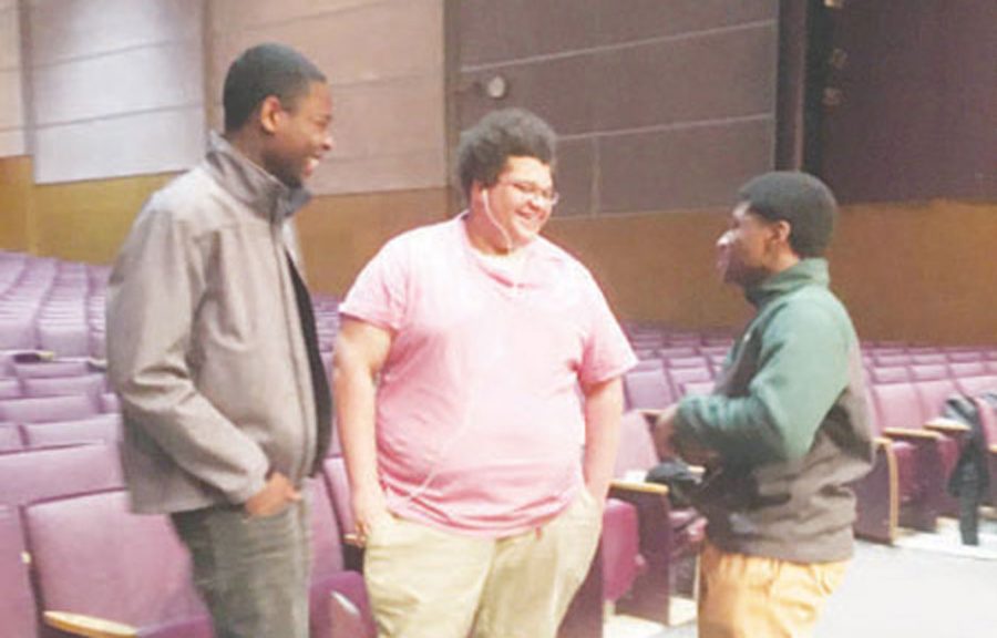 From right, Treyvon Foster (junior), Shane Collins
(junior), and Avery Cosey (senior) discuss plans for
“In The Heights.”