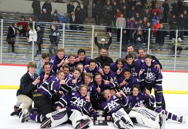 The Pioneer varsity hockey team celebrates their victory of the 2020 Jilek Cup.