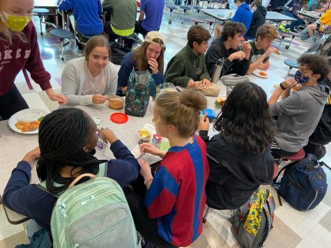 Inside the cafeteria, students crowd around tables with seats just seven inches apart, nowhere near the six feet recommended by the Center for Disease Control.