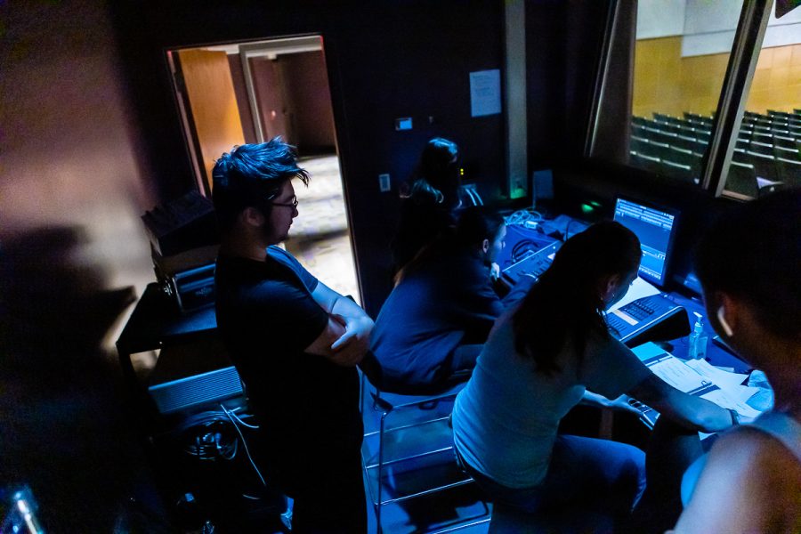Backstage student crew members work on the recent production Into the Woods.