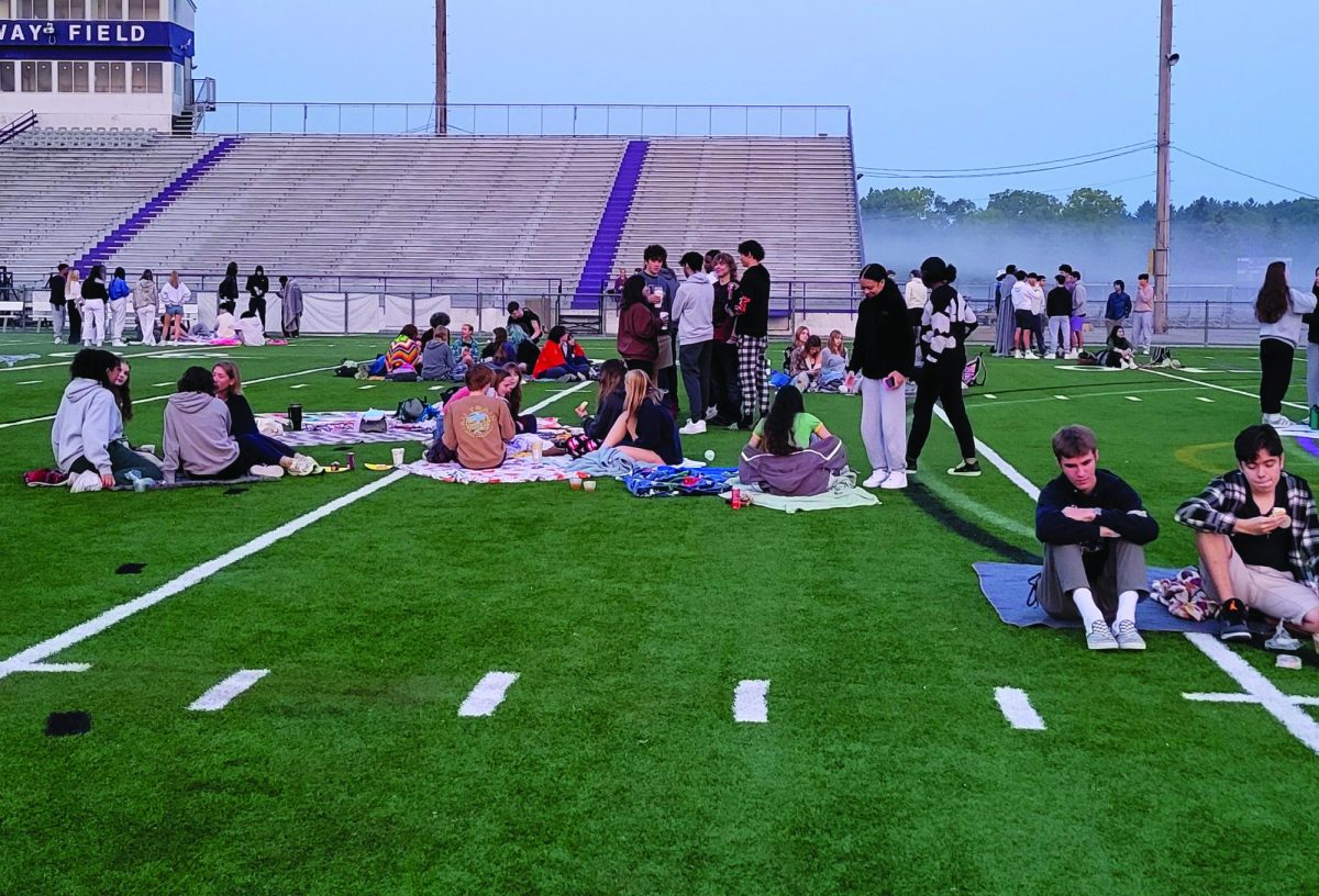 Seniors spread out to watch the sun rise Sept. 12 on Hollway Field for the Senior Sunrise.